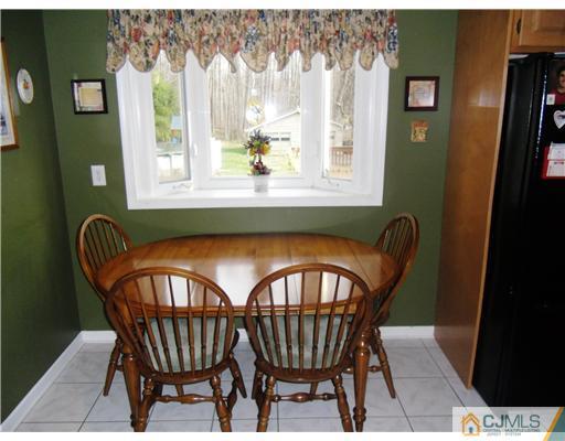 242 New Road Monmouth Junction, NJ 08852 - Photo 6 of 11 a view of a dining room with furniture and window