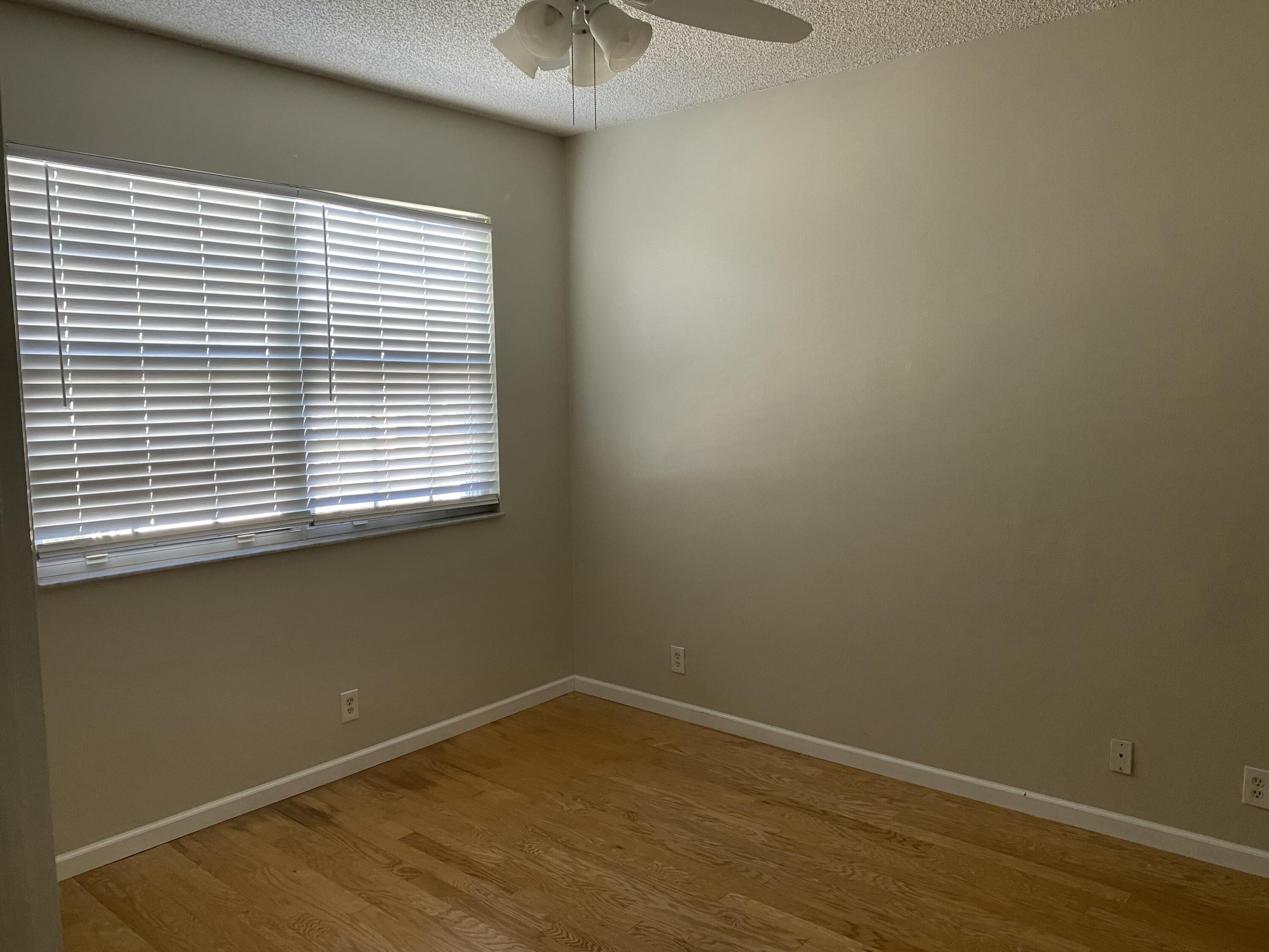 101 Lighthouse Circle, Unit J Tequesta, FL 33469 - Photo 11 of 13 an empty room with a window