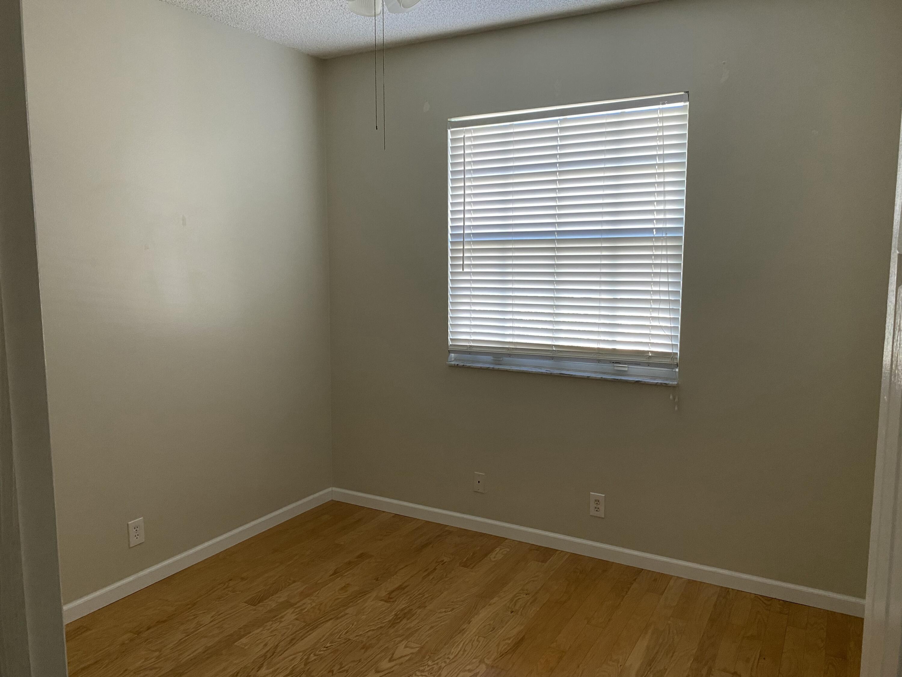 101 Lighthouse Circle, Unit J Tequesta, FL 33469 - Photo 10 of 13 a view of an empty room with a window