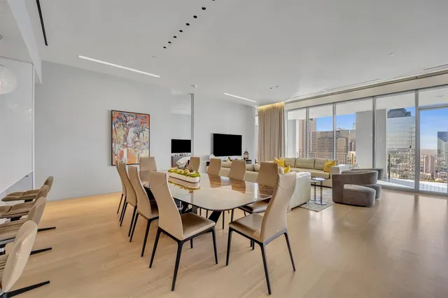 a view of a dining room with furniture window and wooden floor