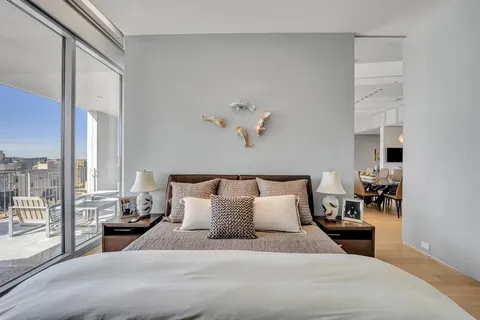 a bedroom with furniture and a window