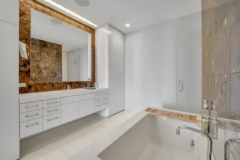 a bathroom with a bathtub and a sink