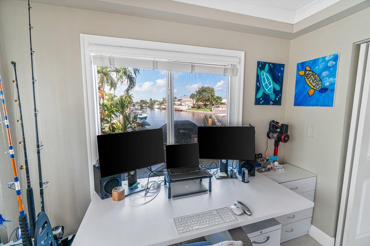 2311 Northeast 36th Street, Unit 1A Lighthouse Point, FL 33064 - Photo 17 of 29 a view of a workspace with furniture and a window
