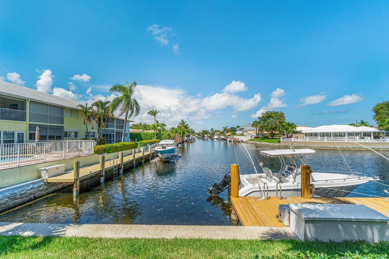 2311 Northeast 36th Street, Unit 1A Lighthouse Point, FL 33064 - Photo 25 of 29 a view of a house with yard and lake view