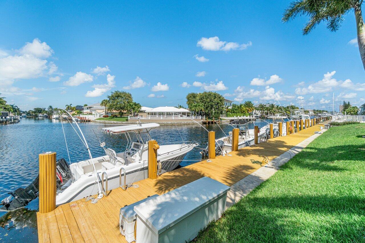 2311 Northeast 36th Street, Unit 1A Lighthouse Point, FL 33064 - Photo 27 of 29 a view of a lake with couches chairs and city view