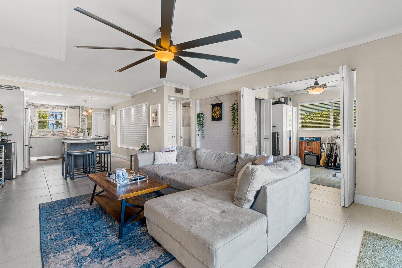 2311 Northeast 36th Street, Unit 1A Lighthouse Point, FL 33064 - Photo 10 of 29 a living room with furniture and a view of kitchen