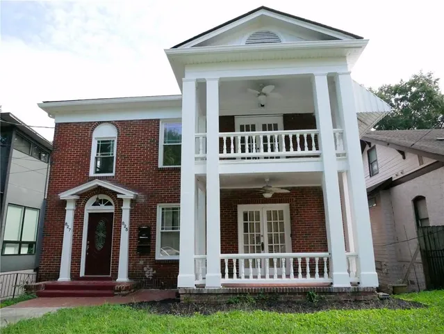 front view of a house with a yard