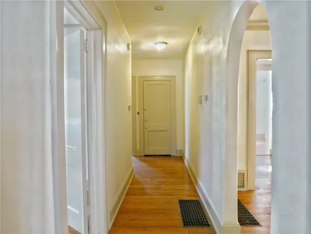 a view of a bathroom from a hallway