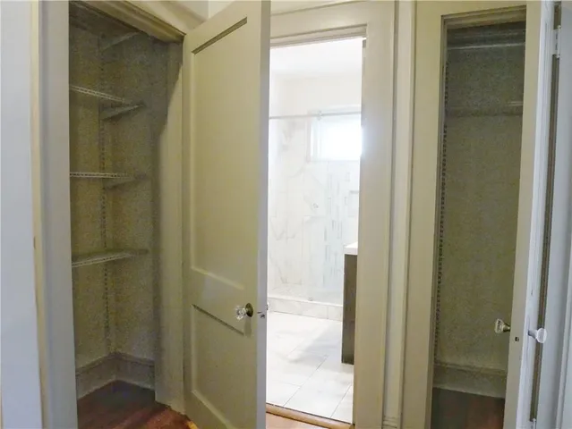 a bathroom with a glass door shower