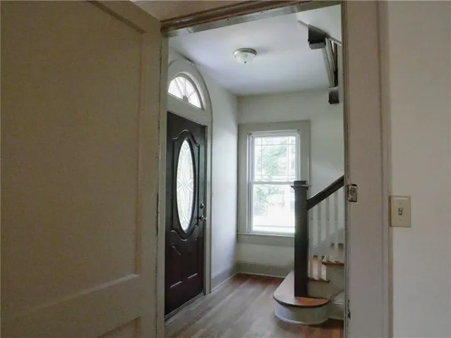 a view of entryway with wooden floor