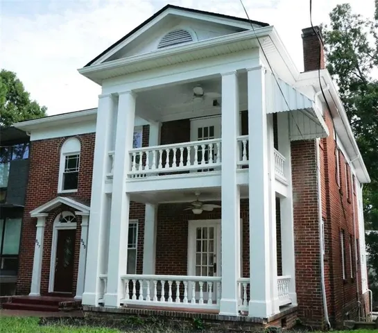 a front view of a house with garage