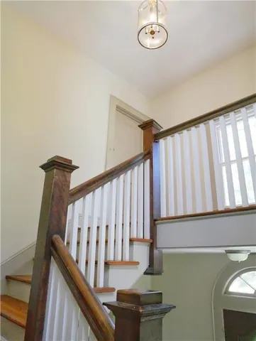 a view of entryway with stairs and wooden floor