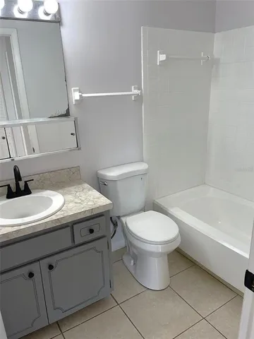 a bathroom with a sink a toilet and a bathtub