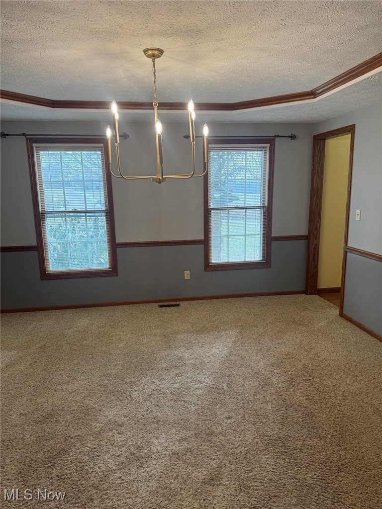 3530 State Road Medina, OH 44256 - Photo 11 of 47 Carpeted dining room featuring a textured ceiling