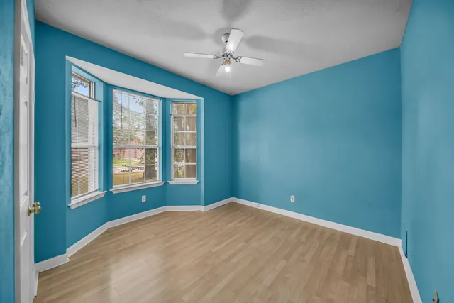 a front view of a house with a garden and porch