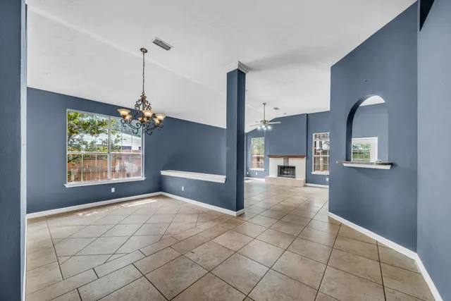 a view of a room window and wooden floor