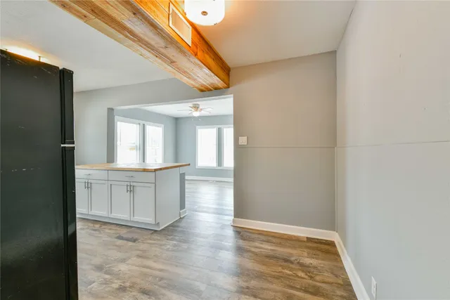 a view of cabinets and wooden floor