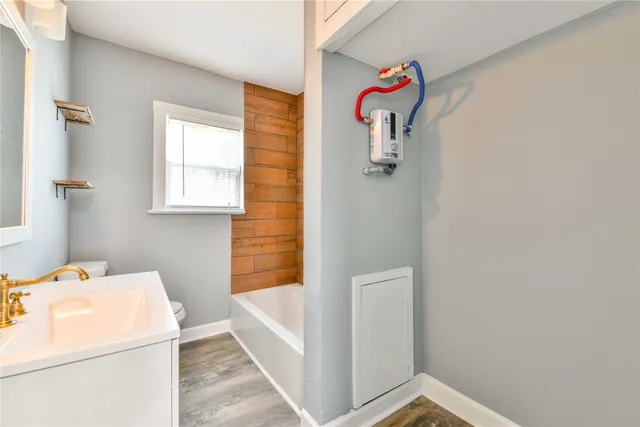 a bathroom with a sink and a shower