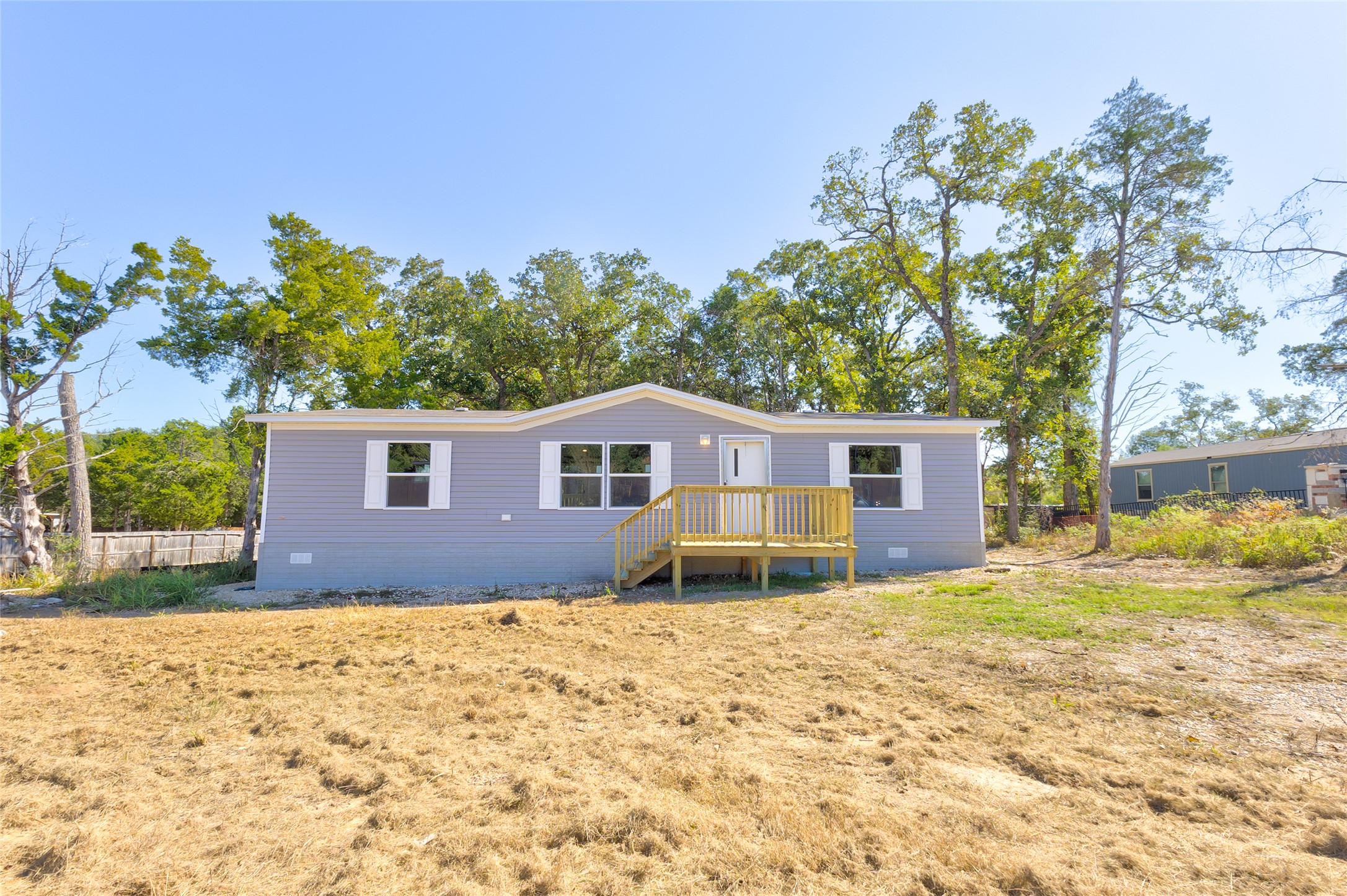 107 Los Cueva Road Elgin, TX 78621 - Photo 1 of 31 a house that has a tree in front of it