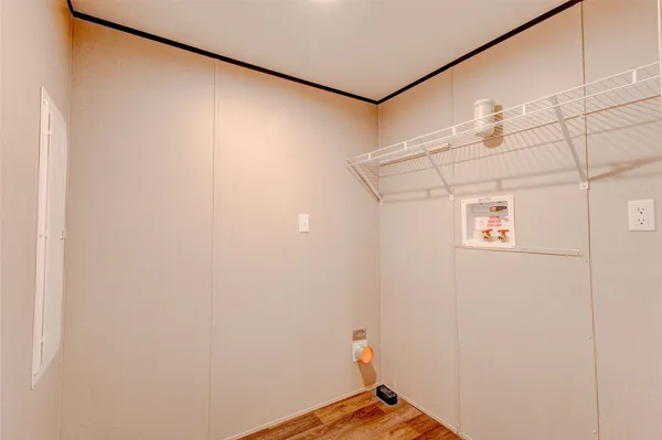 a kitchen with kitchen island a counter top space cabinets and stainless steel appliances