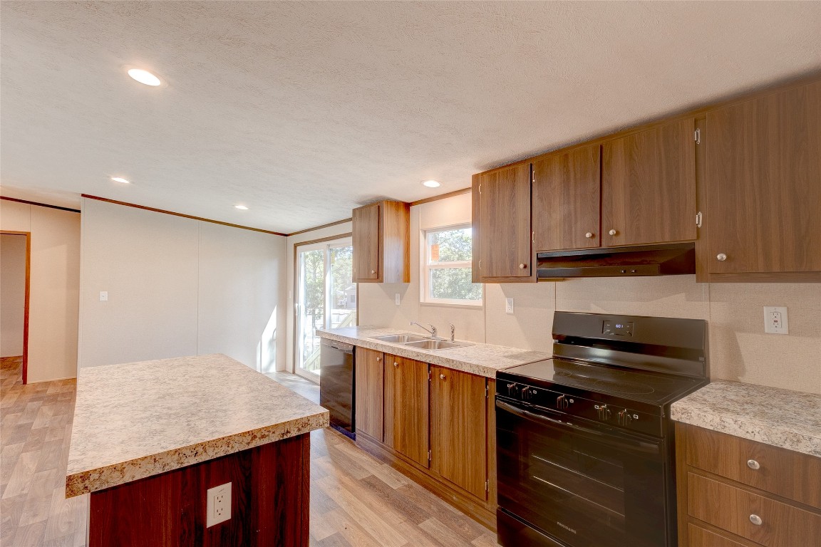 107 Los Cueva Road Elgin, TX 78621 - Photo 14 of 31 a kitchen with a stove and a sink