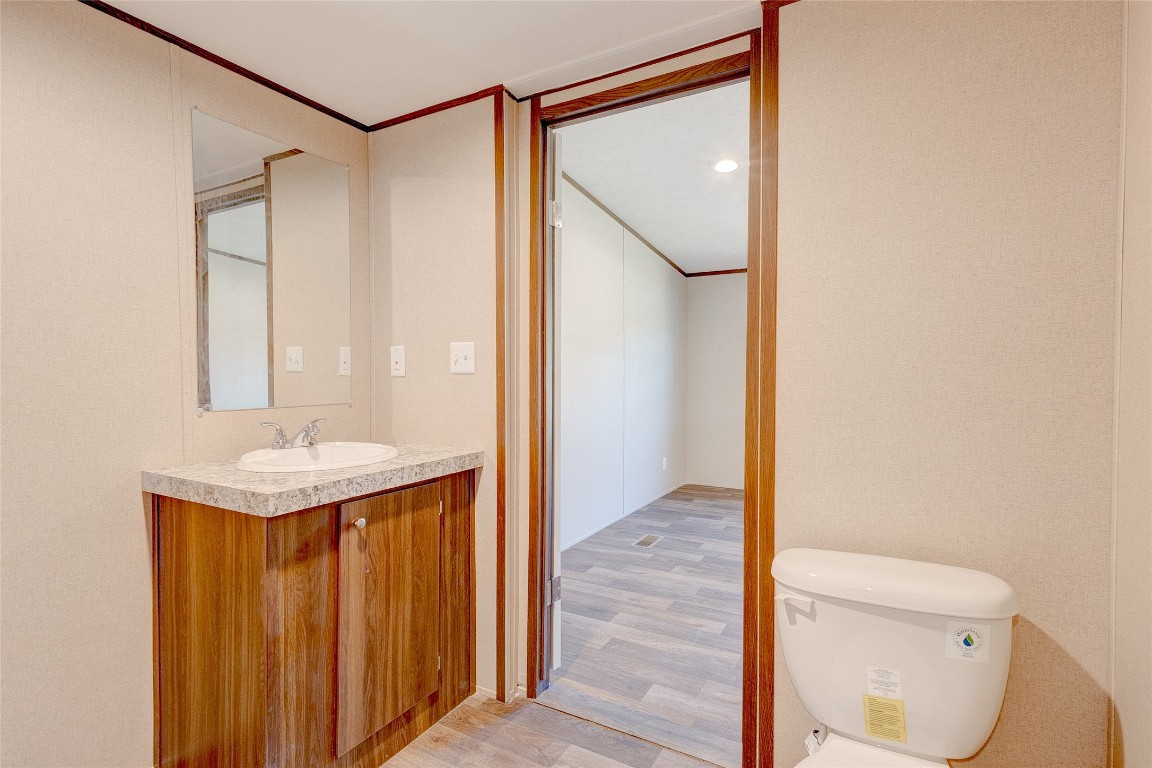 107 Los Cueva Road Elgin, TX 78621 - Photo 24 of 31 a bathroom with a granite countertop sink toilet and shower