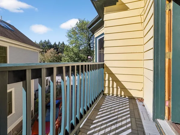 a view of a house with wooden floor and fence