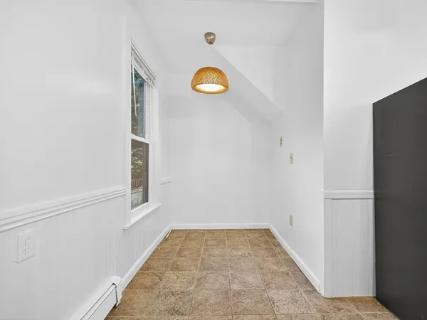 a view of a room with rack and a window