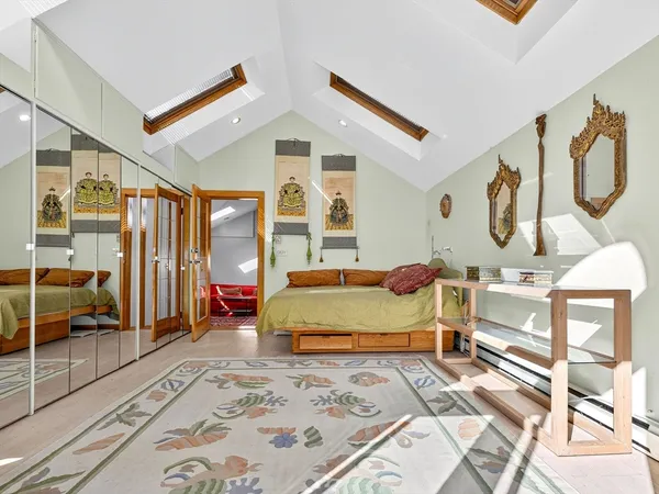 a bedroom with a bed and window