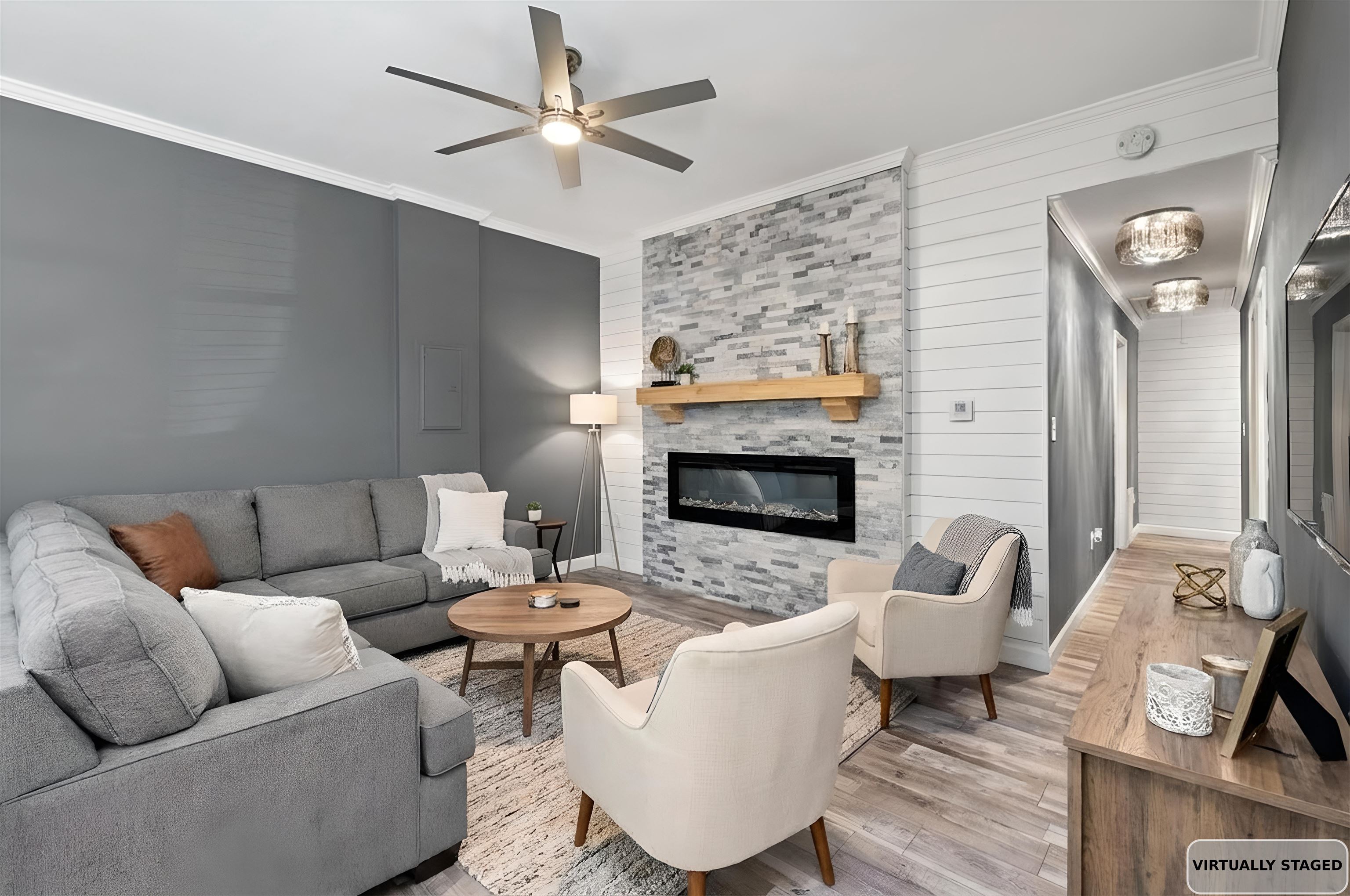 710 Philadelphia Street Memphis, TN 38104 - Photo 6 of 25 a living room with furniture a flat screen tv and a fireplace