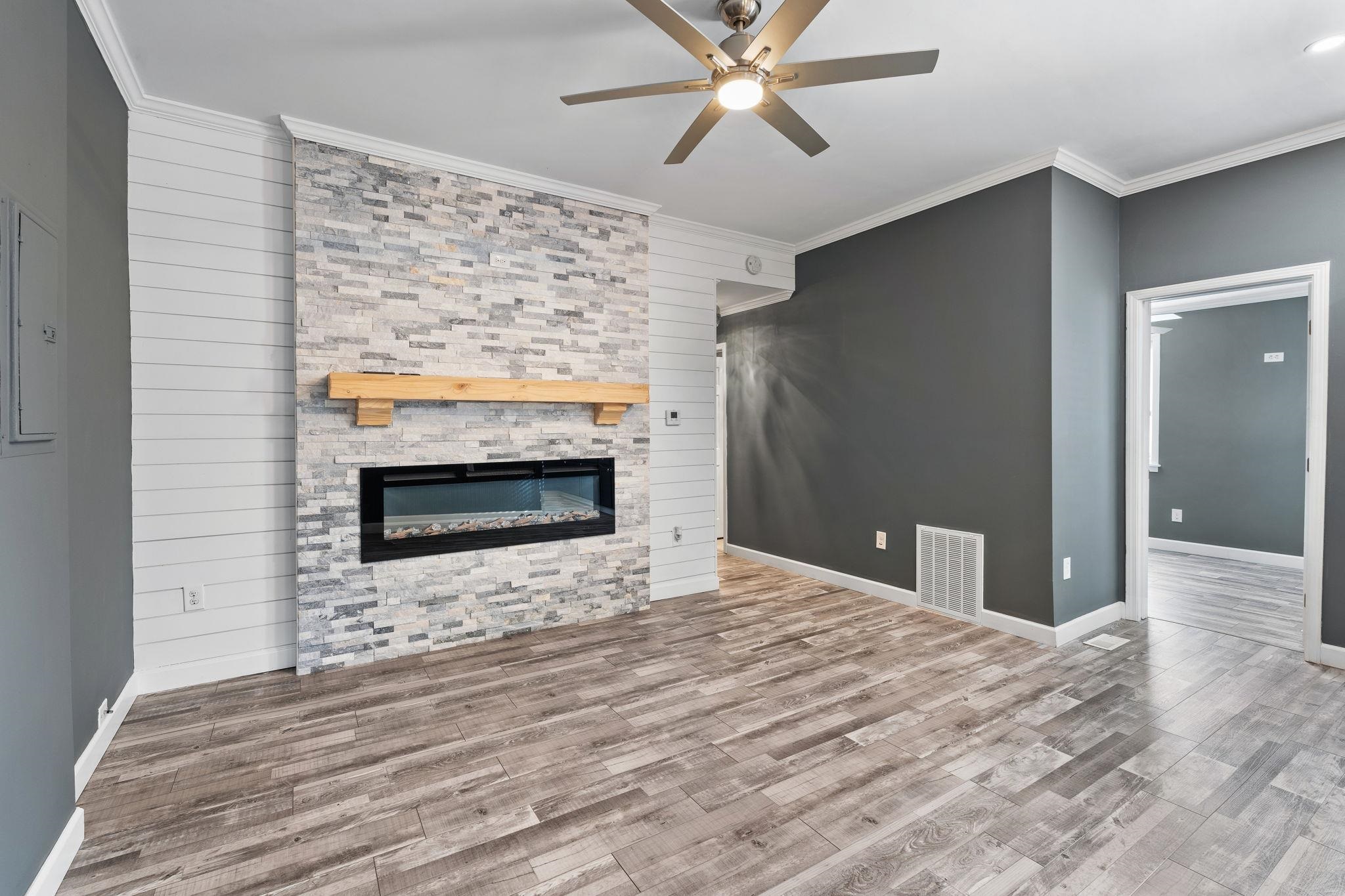 710 Philadelphia Street Memphis, TN 38104 - Photo 8 of 25 a bedroom with a bed and a fireplace