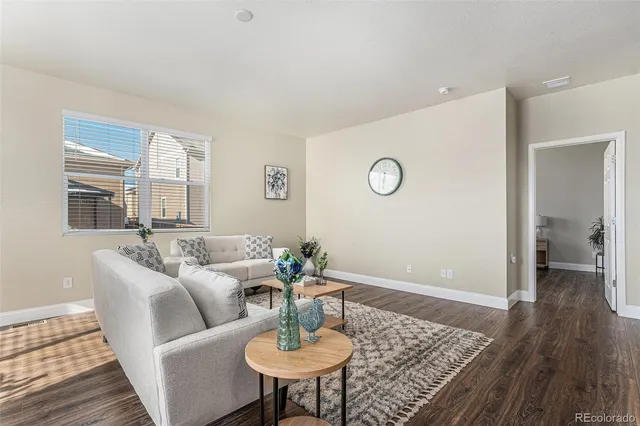 a living room with furniture and a table