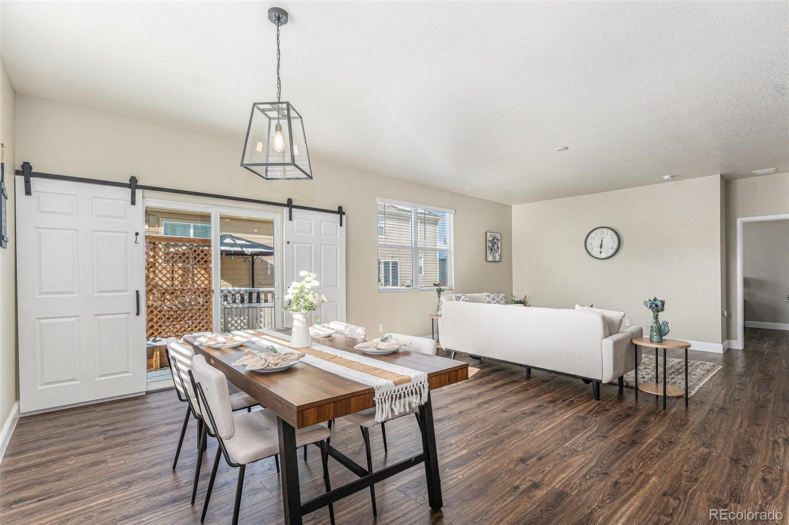 1051 Draw Street Brighton, CO 80603 - Photo 6 of 19 a view of a dining room with furniture window and wooden floor