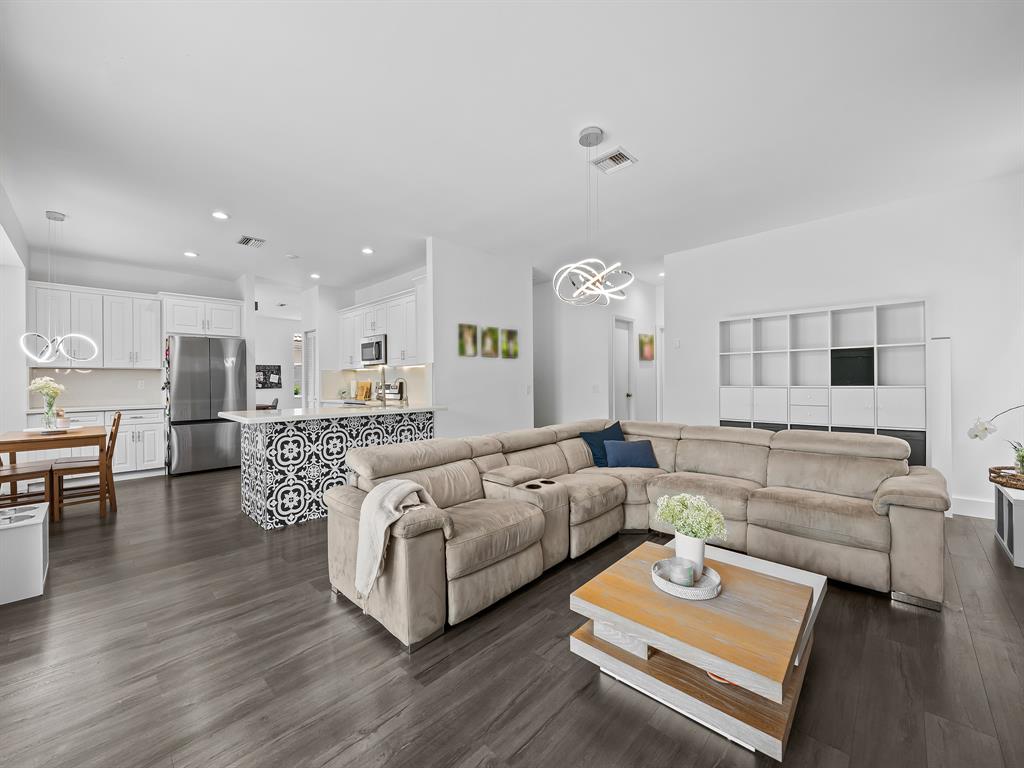 301 Cameron Drive Weston, FL 33326 - Photo 13 of 39 a living room with furniture and a table