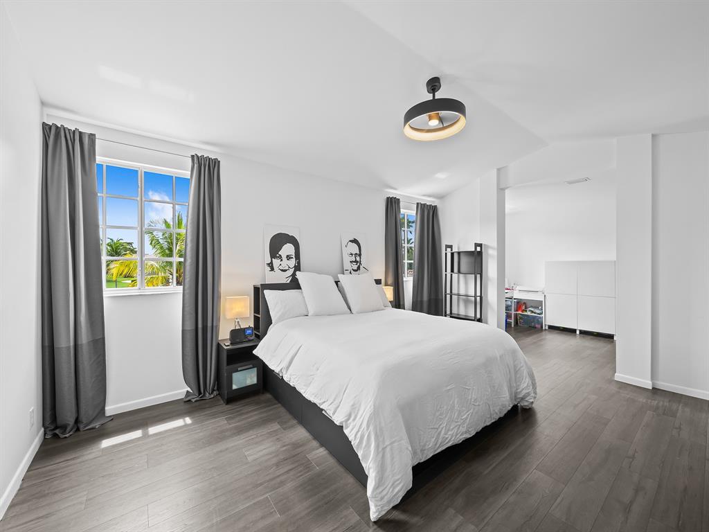 301 Cameron Drive Weston, FL 33326 - Photo 19 of 39 a bedroom with a bed and a window