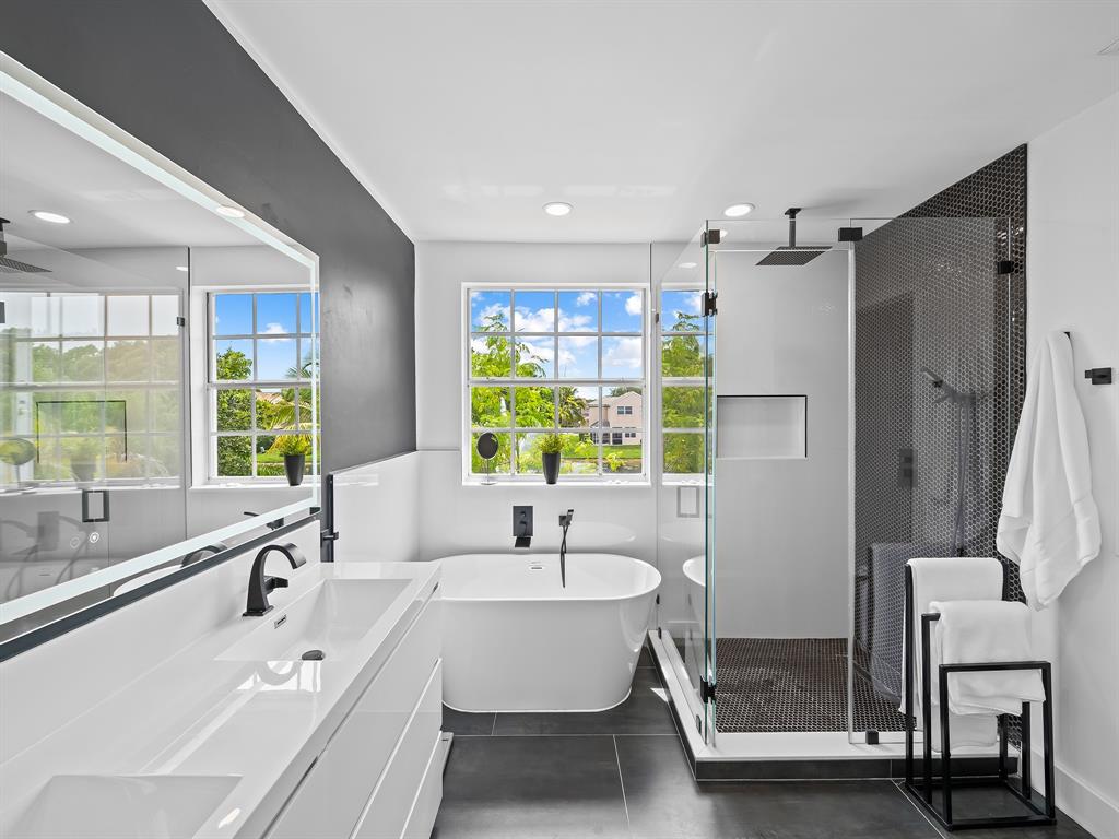 301 Cameron Drive Weston, FL 33326 - Photo 20 of 39 a bathroom with a bathtub and a sink