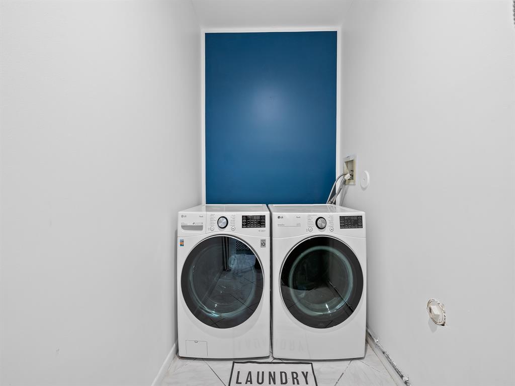 301 Cameron Drive Weston, FL 33326 - Photo 31 of 39 a close view of a utility room with dryer and washer