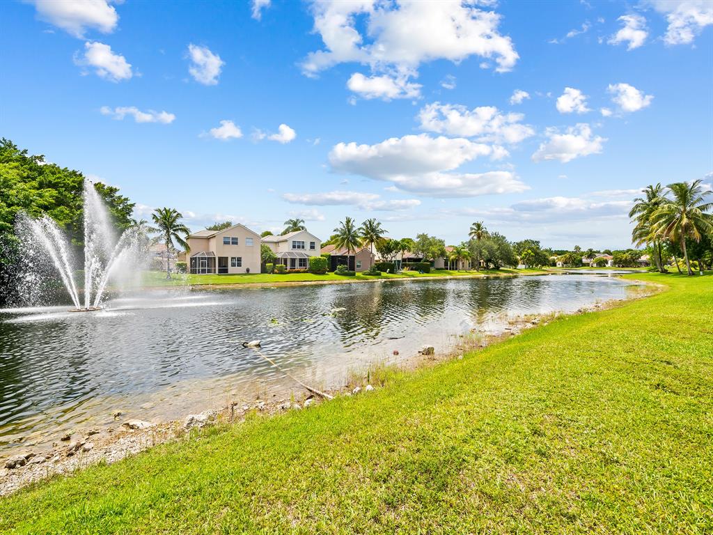 301 Cameron Drive Weston, FL 33326 - Photo 36 of 39 a view of a lake with houses in the back