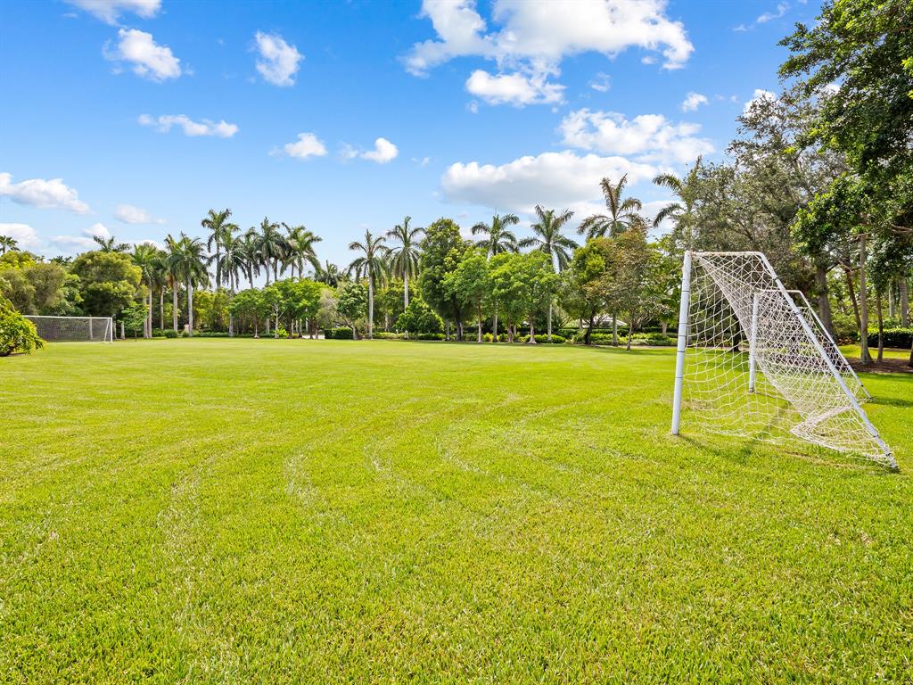 301 Cameron Drive Weston, FL 33326 - Photo 38 of 39 a view of a swimming pool with an outdoor space and seating area