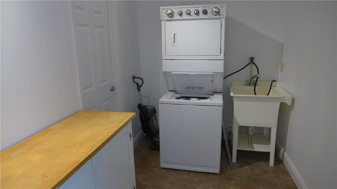 809 North Victoria Park Road Fort Lauderdale, FL 33304 - Photo 18 of 25 a utility room with dryer and washer