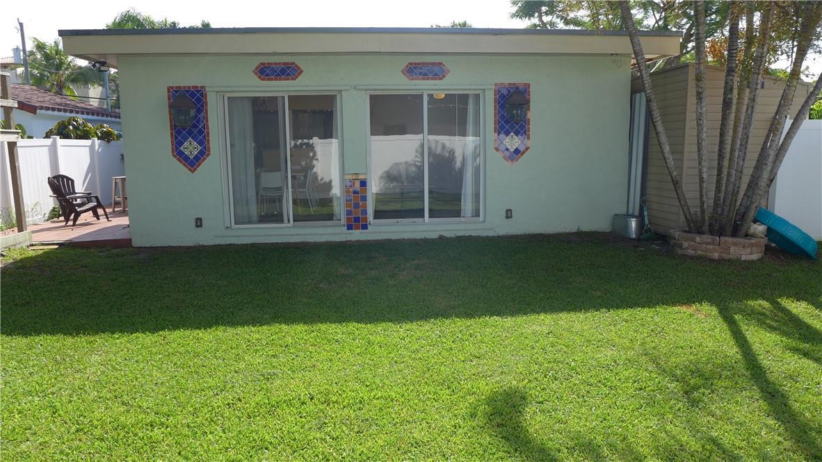 809 North Victoria Park Road Fort Lauderdale, FL 33304 - Photo 19 of 25 a front view of a house with a garden