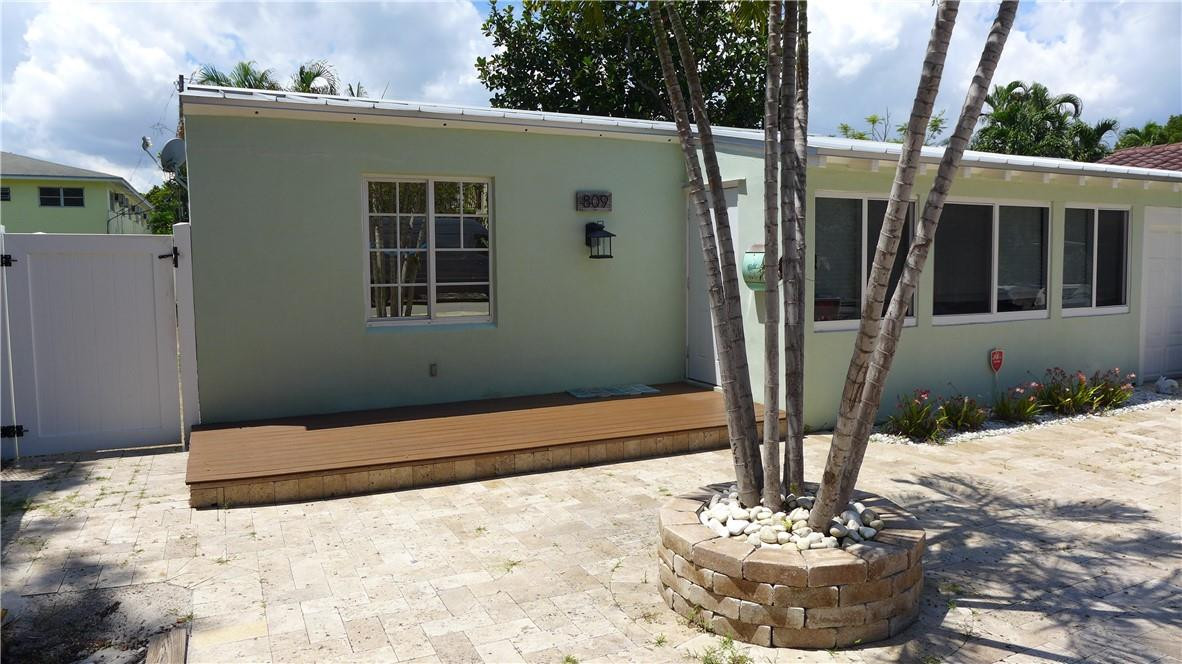 809 North Victoria Park Road Fort Lauderdale, FL 33304 - Photo 23 of 25 a view of a house with backyard and sitting area