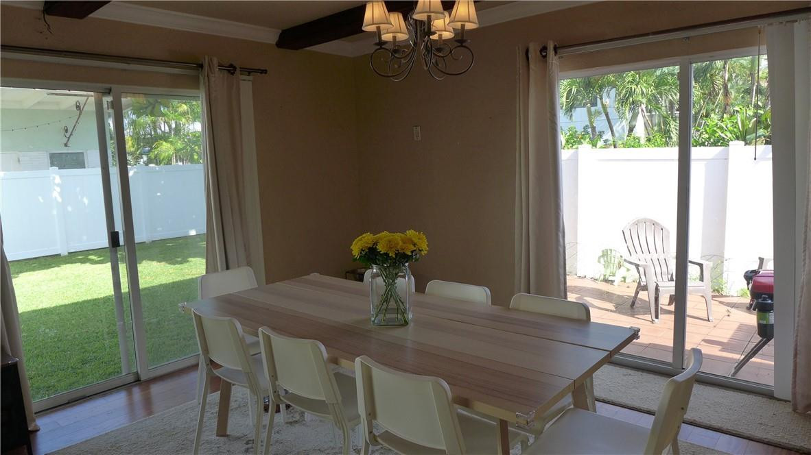 809 North Victoria Park Road Fort Lauderdale, FL 33304 - Photo 10 of 25 a view of a dining room with furniture window and outside view