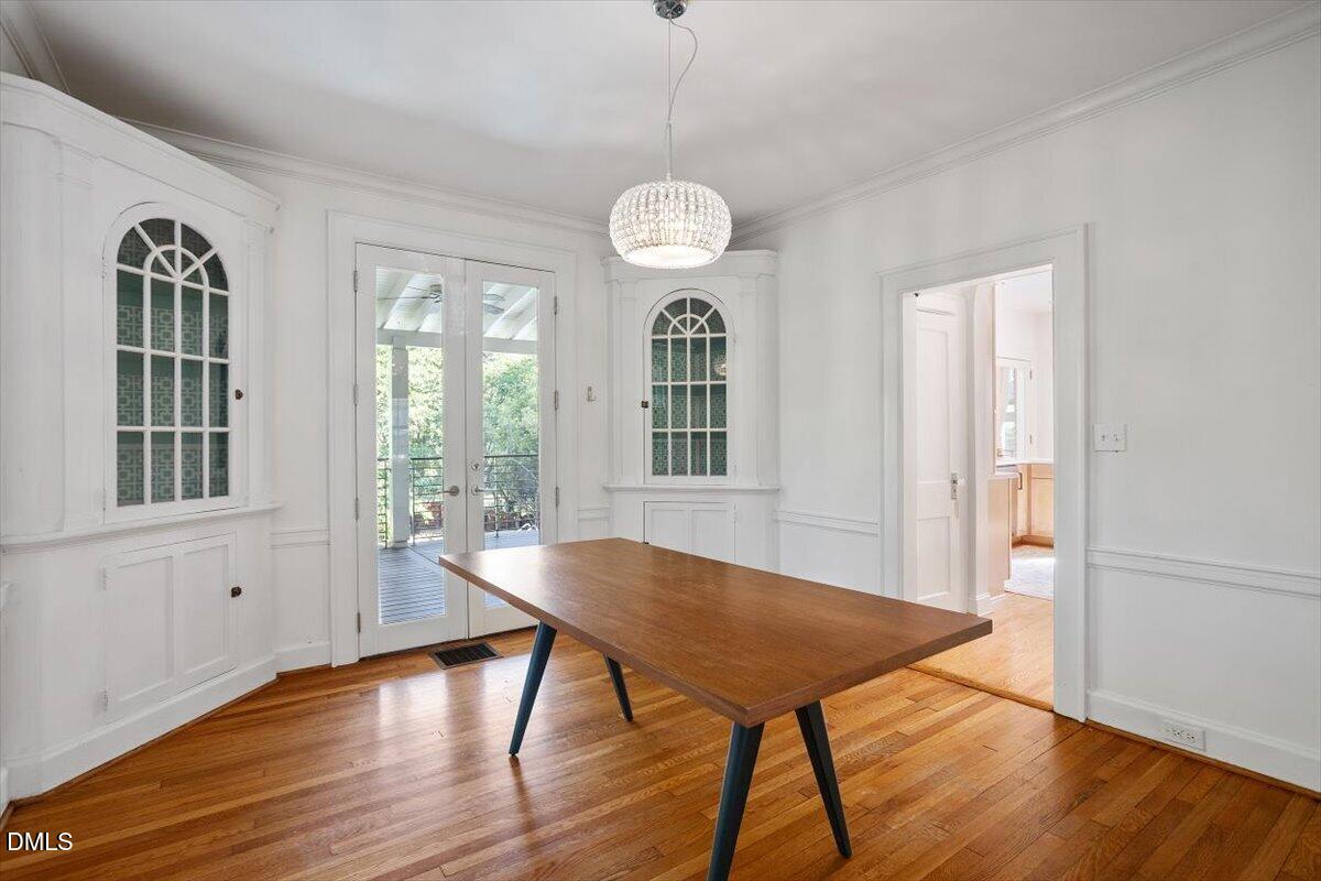 2201 Byrd Street Raleigh, NC 27608 - Photo 17 of 37 a view of a dining room with furniture window and wooden floor