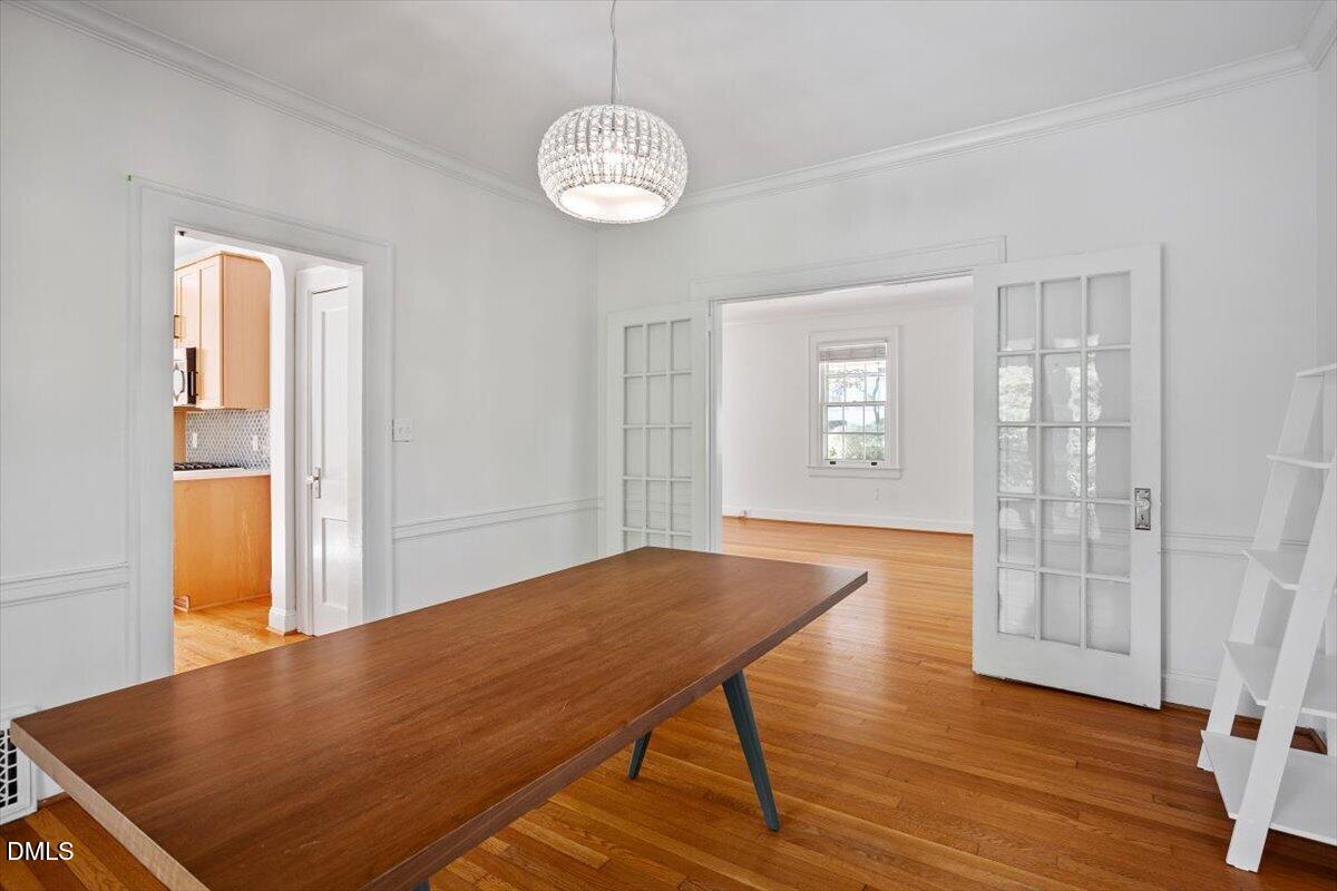 2201 Byrd Street Raleigh, NC 27608 - Photo 18 of 37 a view of empty room with wooden floor and fan