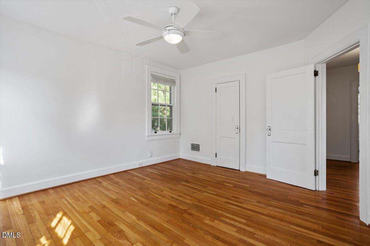 2201 Byrd Street Raleigh, NC 27608 - Photo 32 of 37 wooden floor in an empty room with a window
