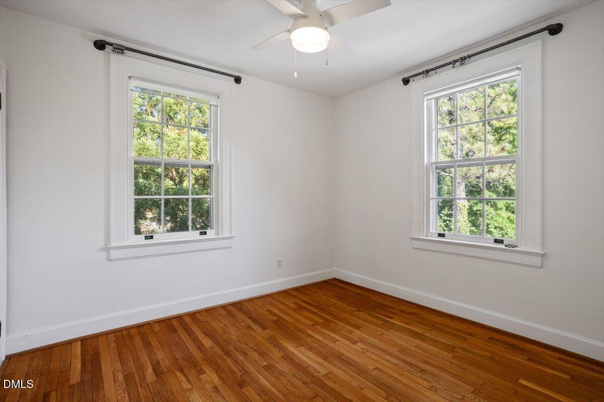 2201 Byrd Street Raleigh, NC 27608 - Photo 35 of 37 a view of empty room with wooden floor and fan