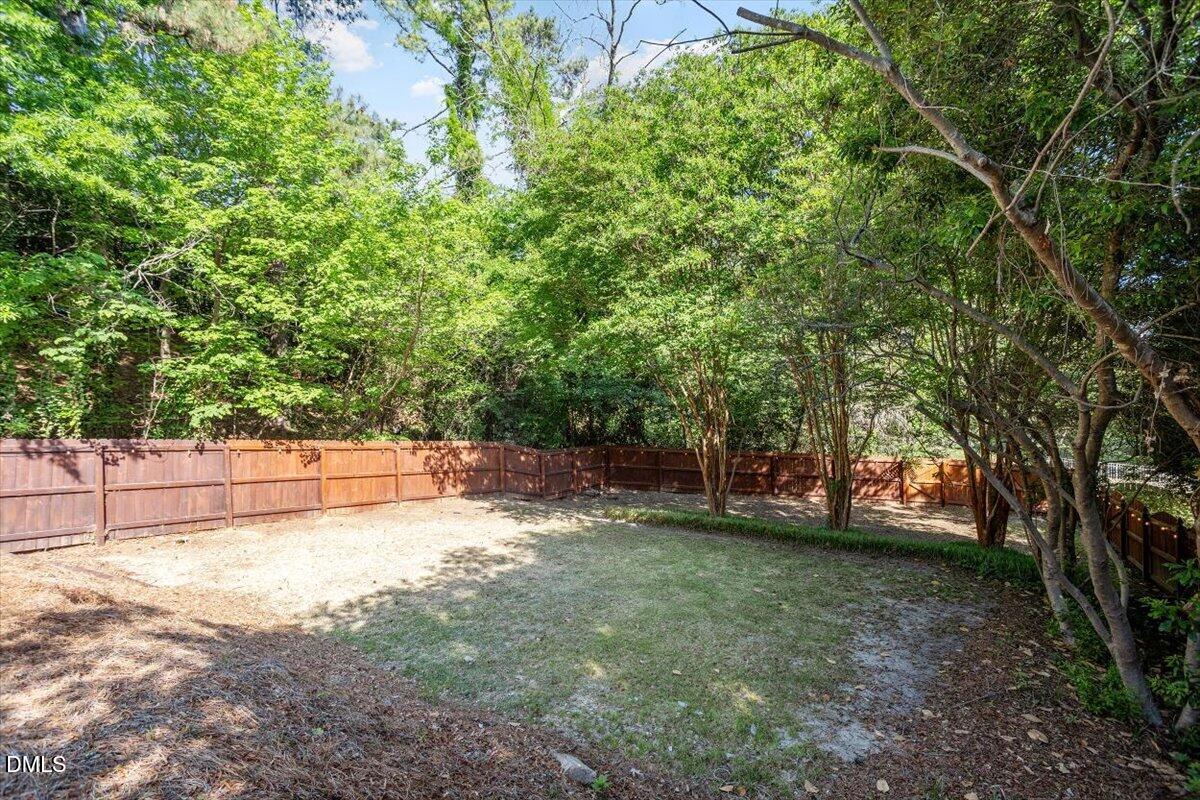 2201 Byrd Street Raleigh, NC 27608 - Photo 8 of 37 a view of a yard with a tree