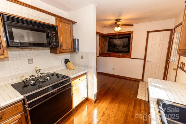 a kitchen with a stove and a microwave