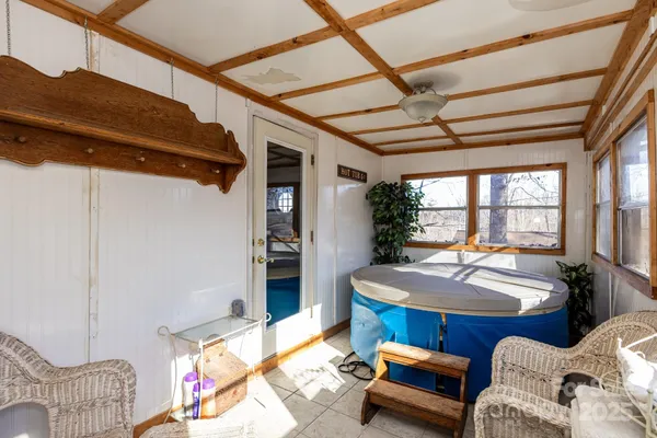 a bedroom with furniture and a window